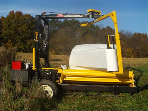 skid steer mounted bale wrapper|ag nation bale handler.